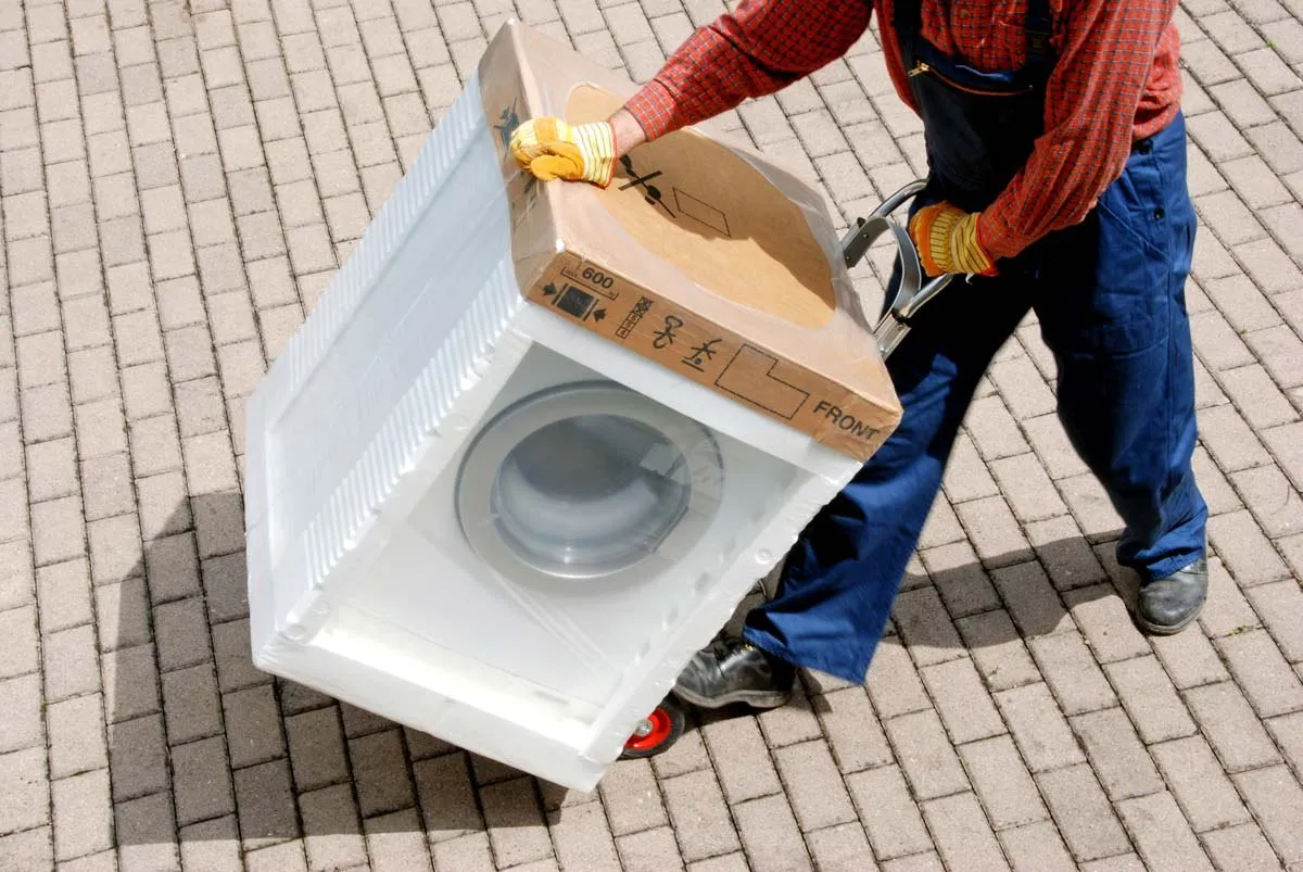 Mover carrying a washing machine