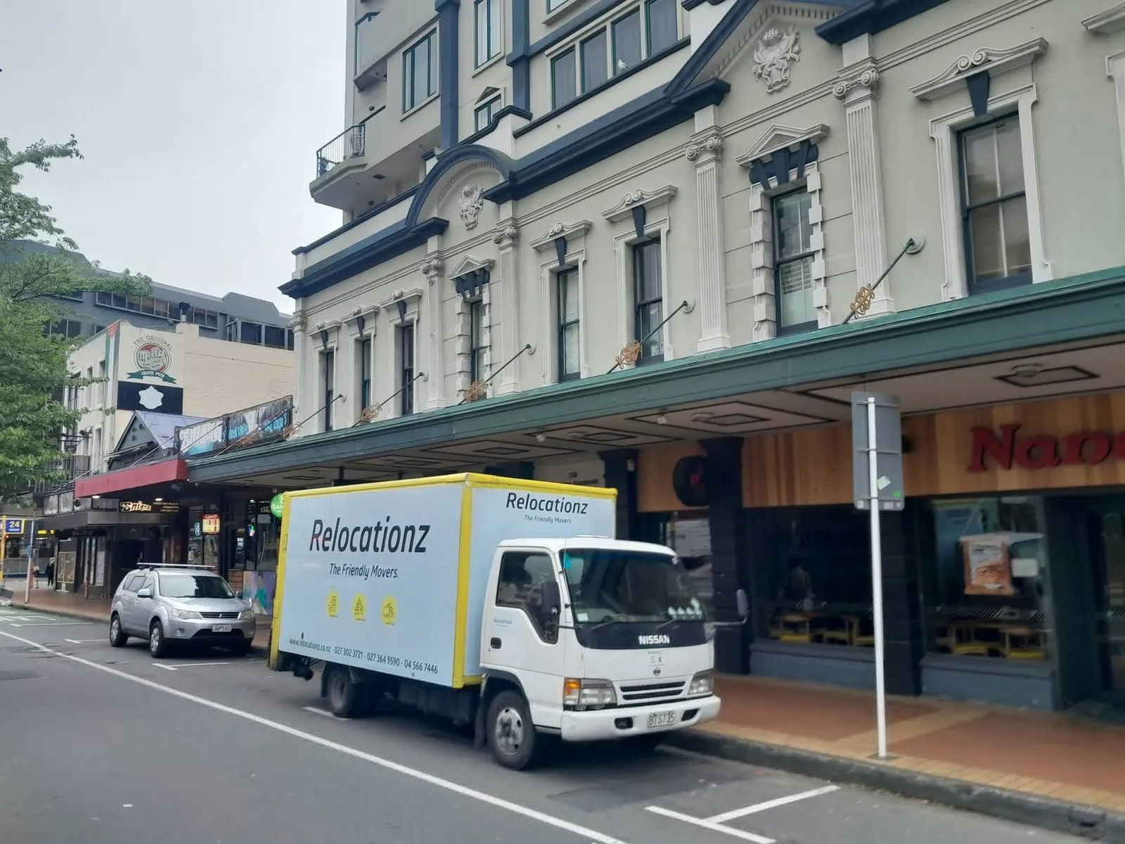 RelocatioNZ moving truck parked outside a Wellington flat